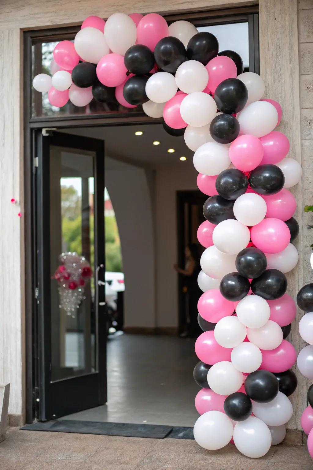 A mesmerizing balloon arch in the party's color scheme sets the scene.