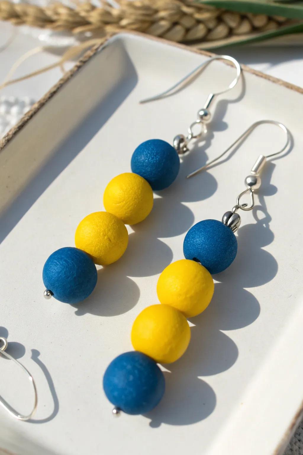 Add a pop of bold color to your style with these handcrafted clay bead earrings. Perfect for those who appreciate minimalist elegance with a vibrant twist.