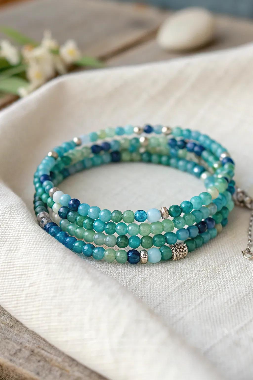 Embrace the ocean's hues with a handcrafted memory wire bracelet, where simplicity meets vibrant elegance.