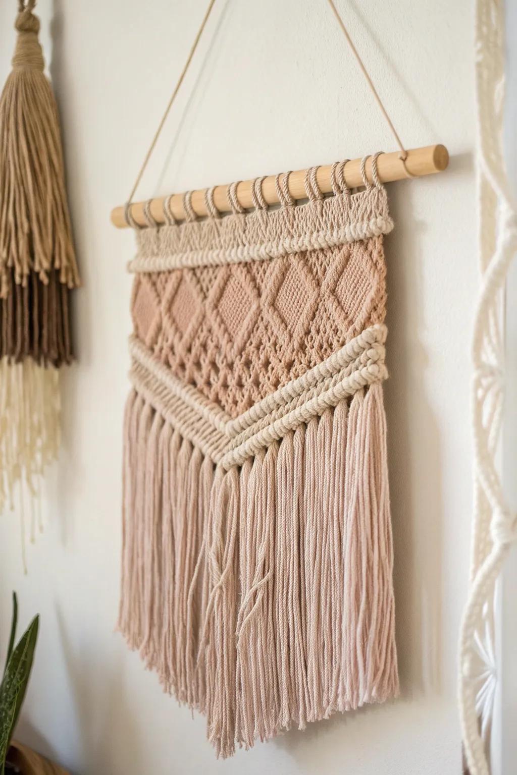 Add a touch of warmth and elegance to your space with this DIY boho-inspired fabric wall hanging.