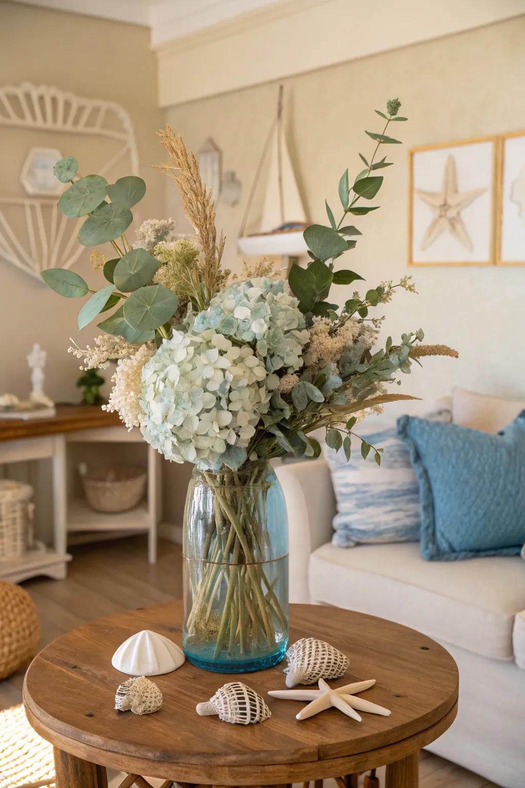 Dried florals in coastal vases for a relaxed look.