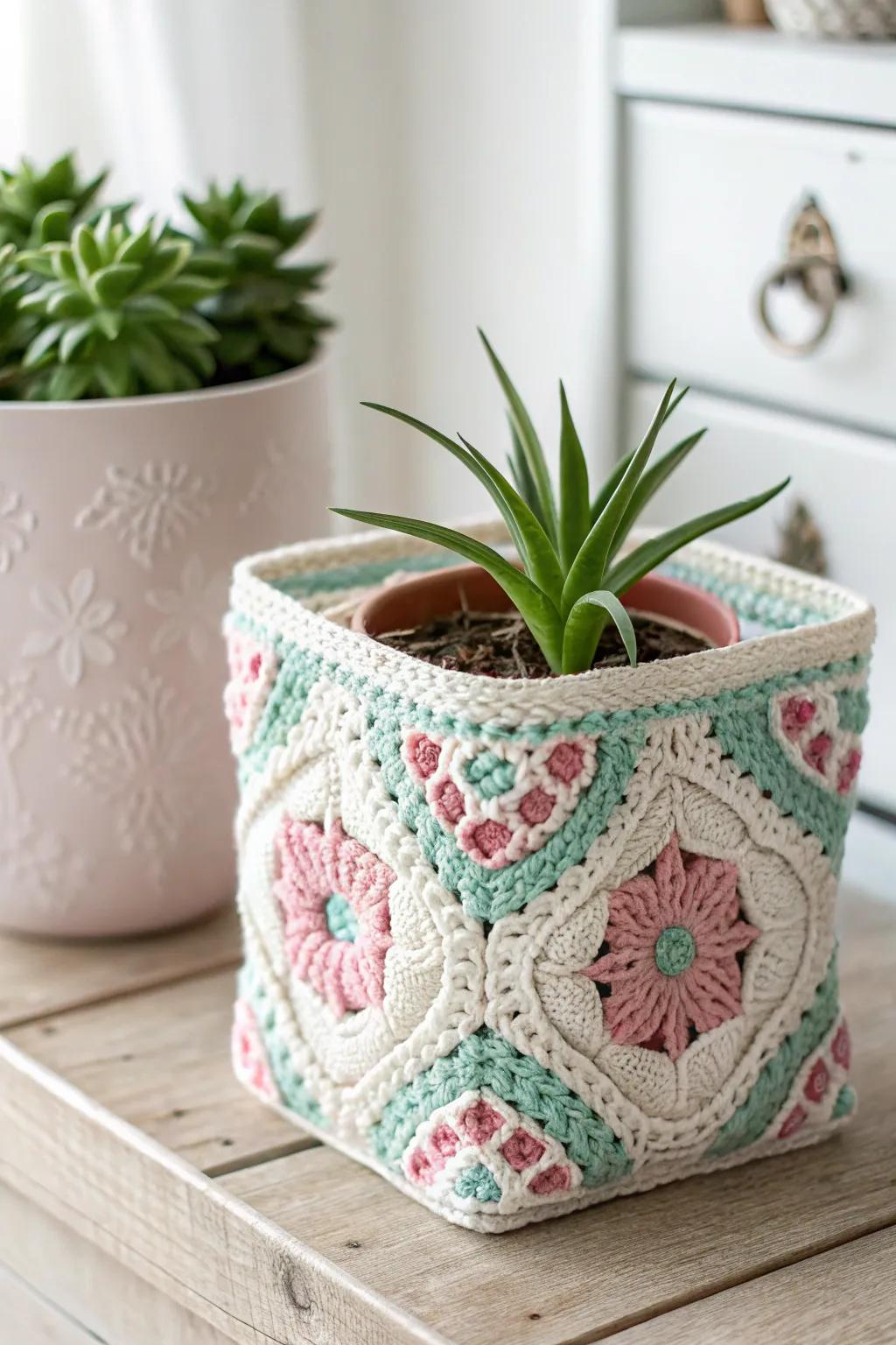 Add a touch of color and craftsmanship to your greenery with a granny square plant pot cover.