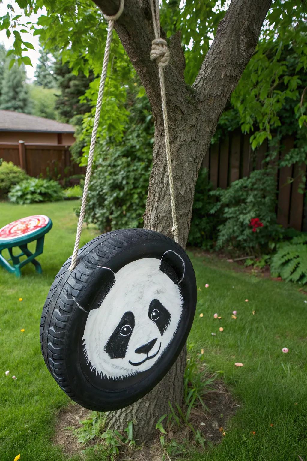 Add a playful twist to your backyard with a handcrafted panda tire swing.