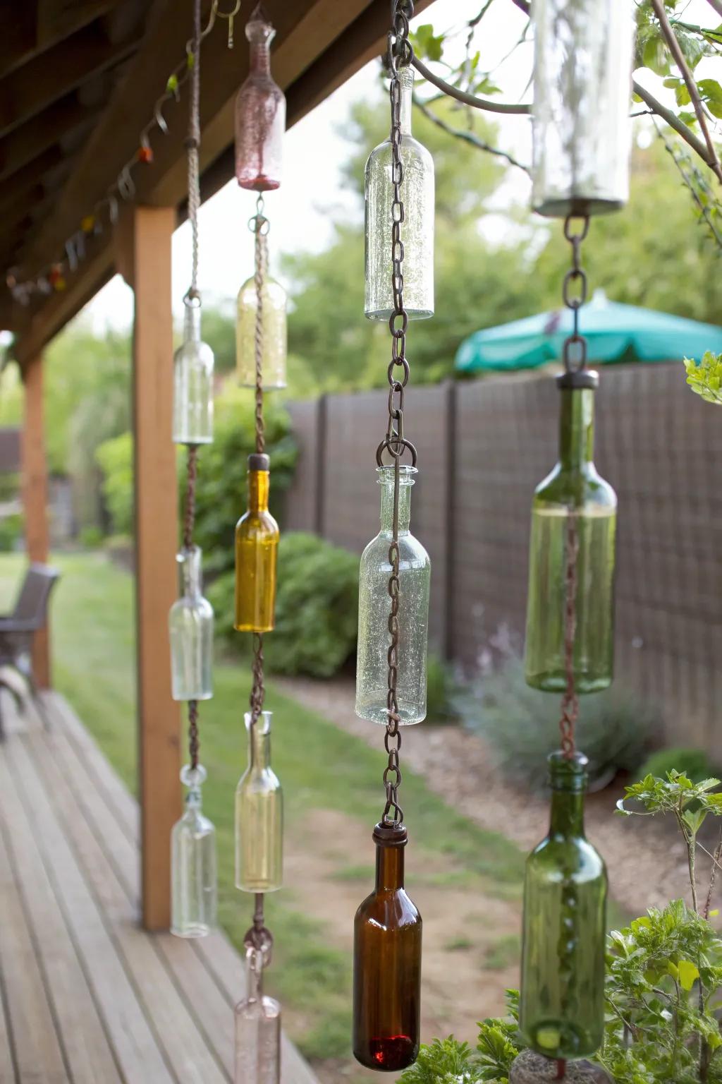 Transform rainy days into a serene spectacle with handcrafted wine bottle rain chains, blending simplicity and natural beauty.