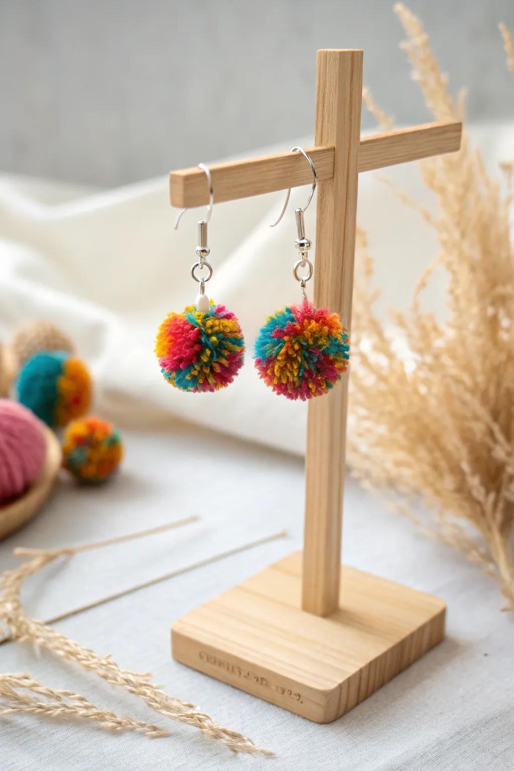 Add a playful pop of color to your look with these charming pom pom earrings.