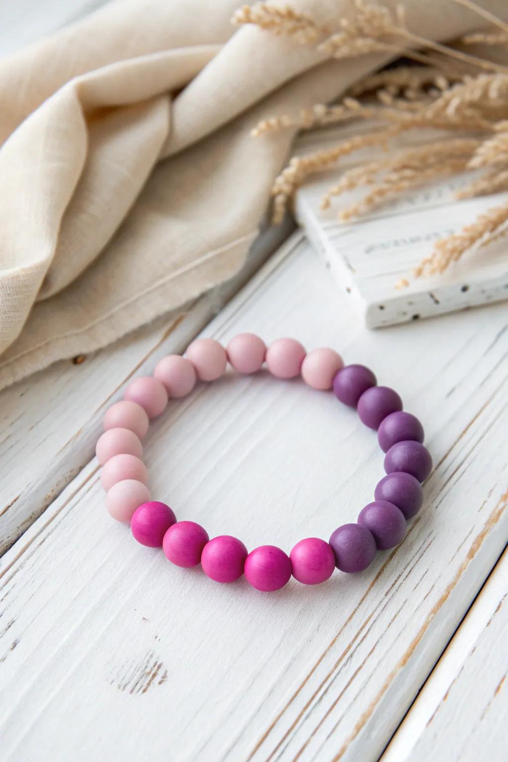 Embrace the elegance of gradient glory with this handcrafted polymer clay bracelet. Perfectly blending Scandinavian minimalism with a Boho touch, this piece is a testament to simplicity and vibrant craftsmanship.