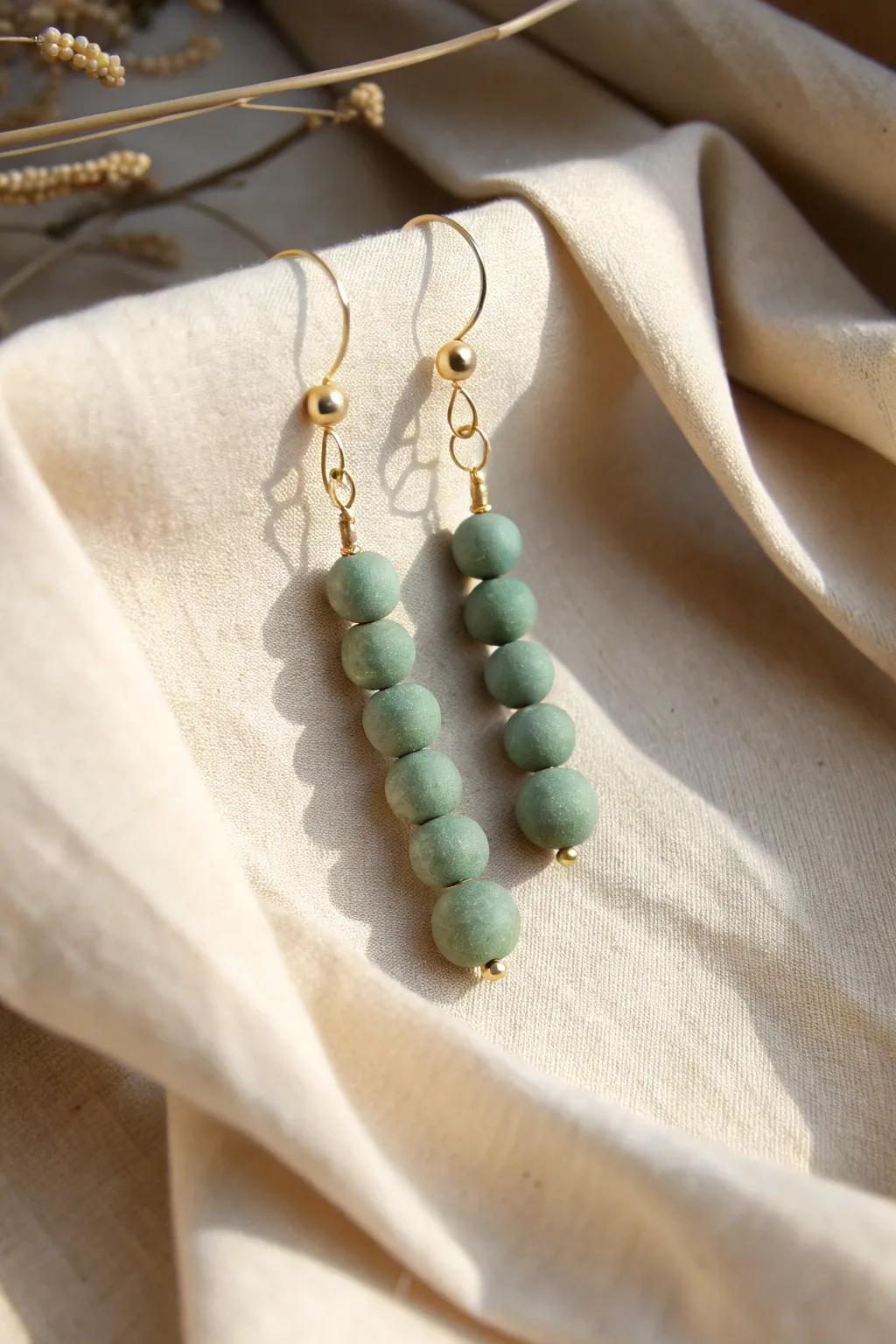 Discover the beauty in simplicity with these handmade clay bead earrings.