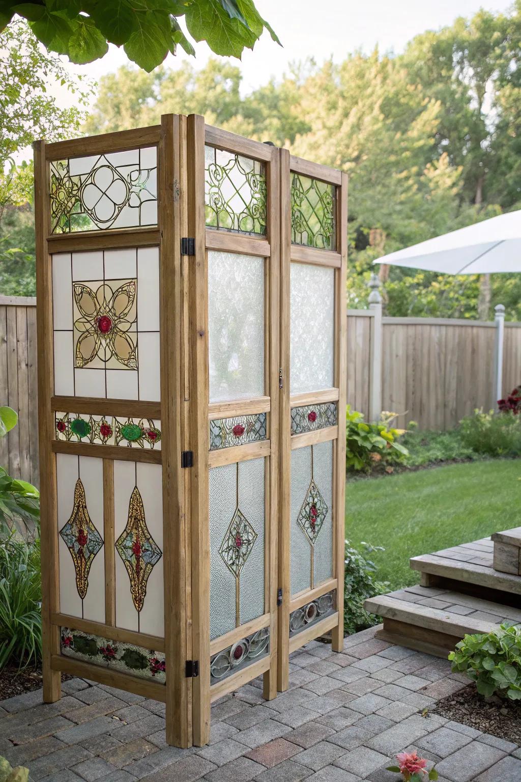 Transform your garden with a whimsical touch: a reclaimed window frame screen that blends simplicity with artistic charm.