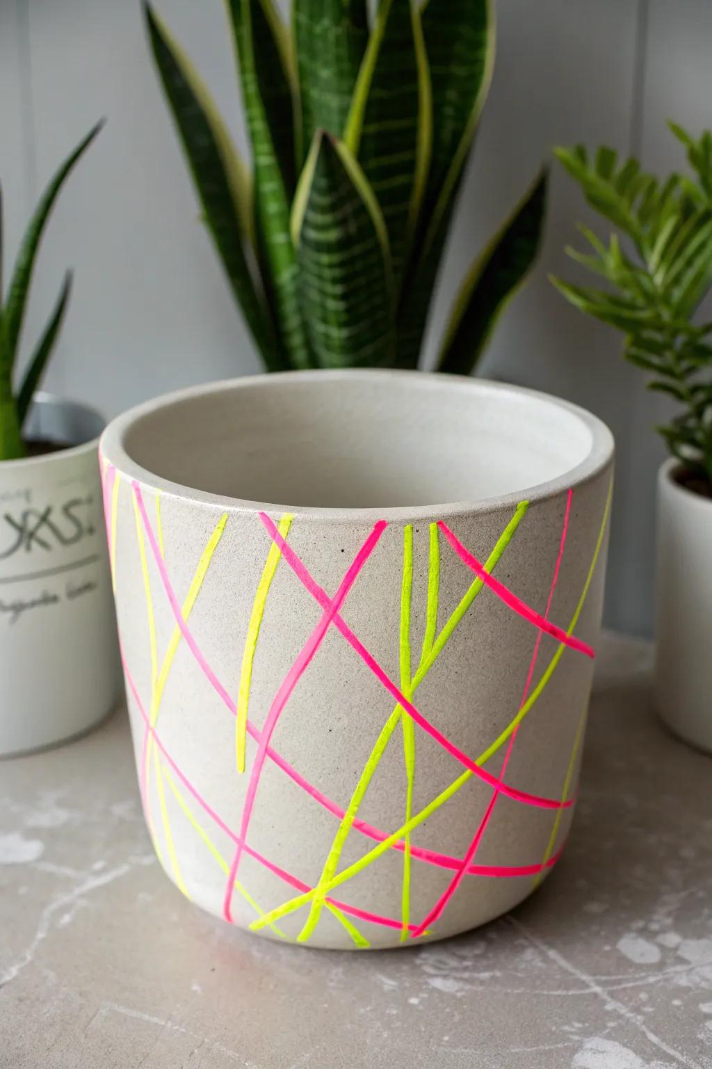 Add a pop of color to your space with neon splashes on minimalist pottery!
