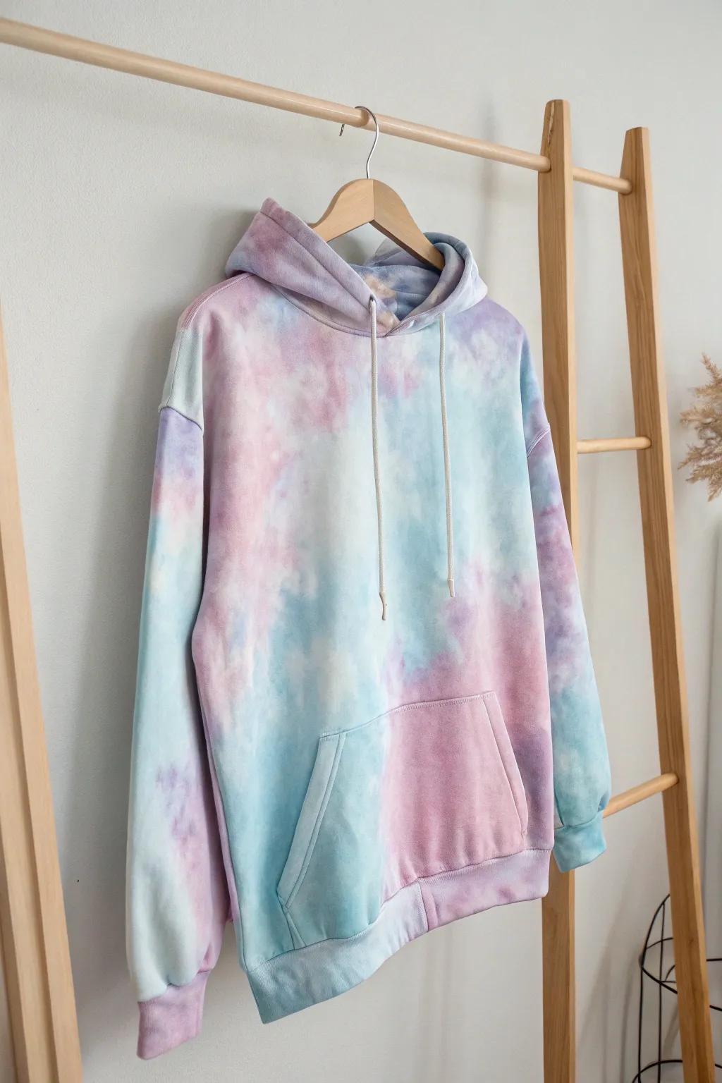 Embrace the dreamscape with this whimsical watercolor hoodie—where minimalism meets artistic flair.