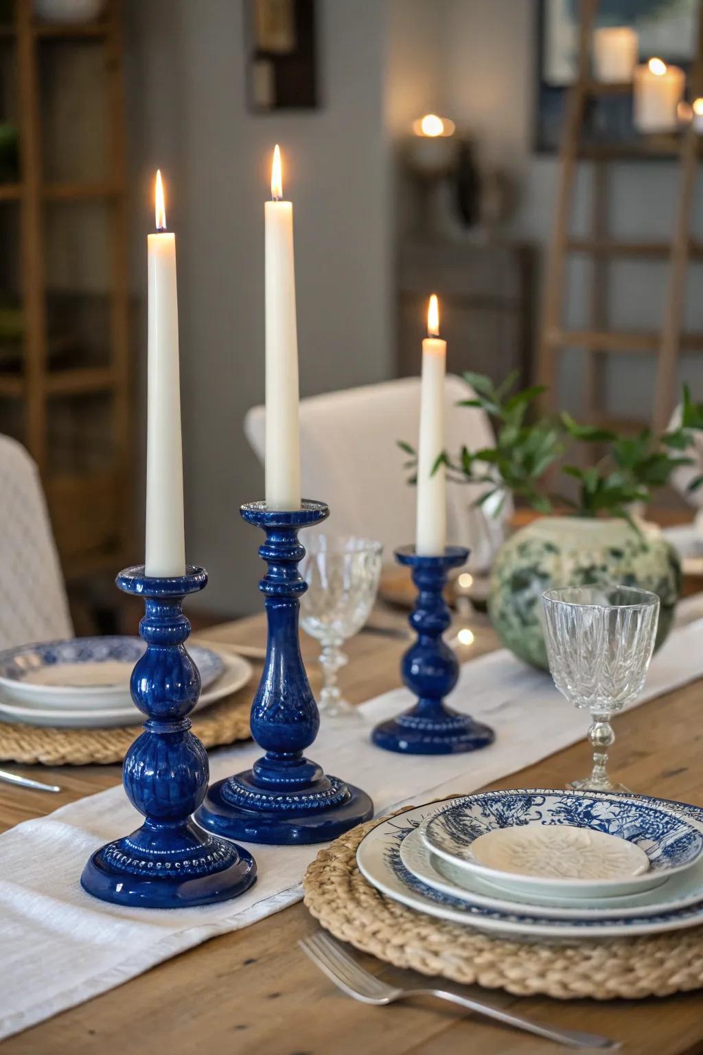 Royal blue candle holders paired with white candles create an elegant and cozy ambiance.