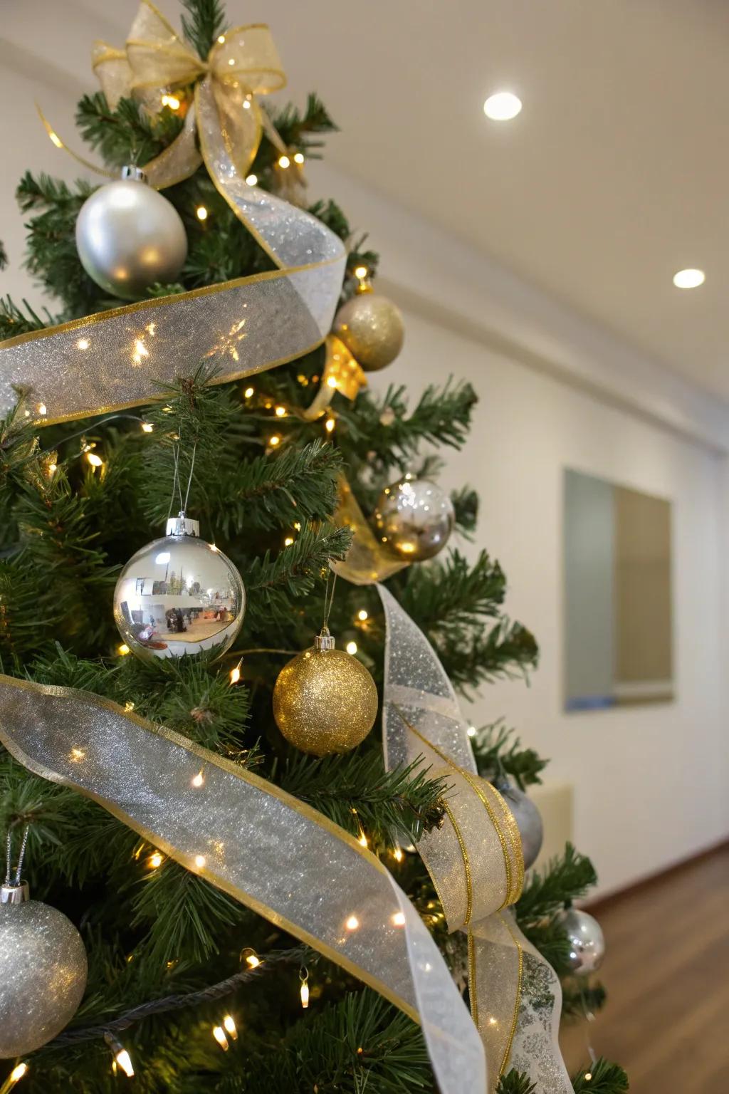 A modern glam Christmas tree with metallic ribbons adding a luxurious touch.