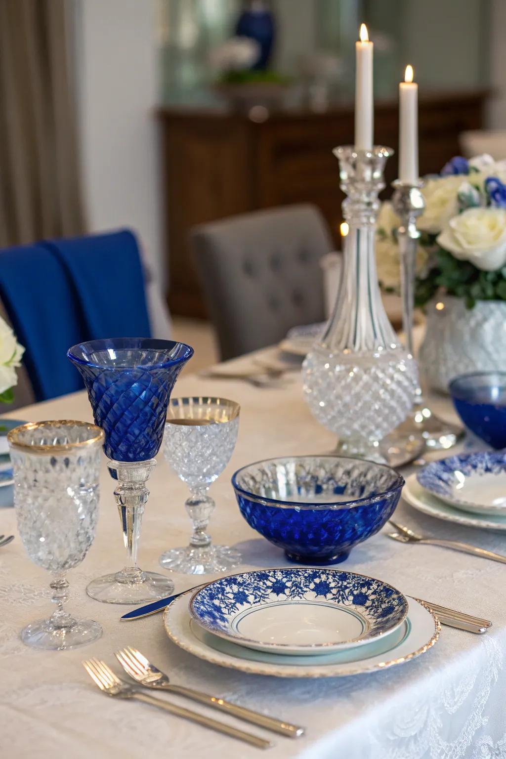 Crystal and glass accents with royal blue details add a touch of glamour to the table.