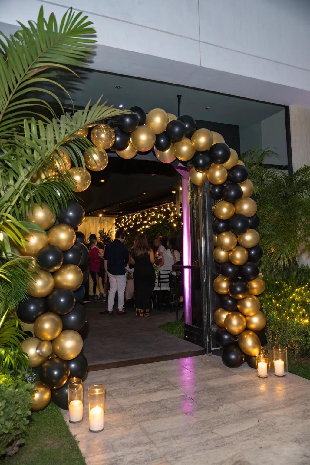 A gold and black balloon arch makes a grand entrance.