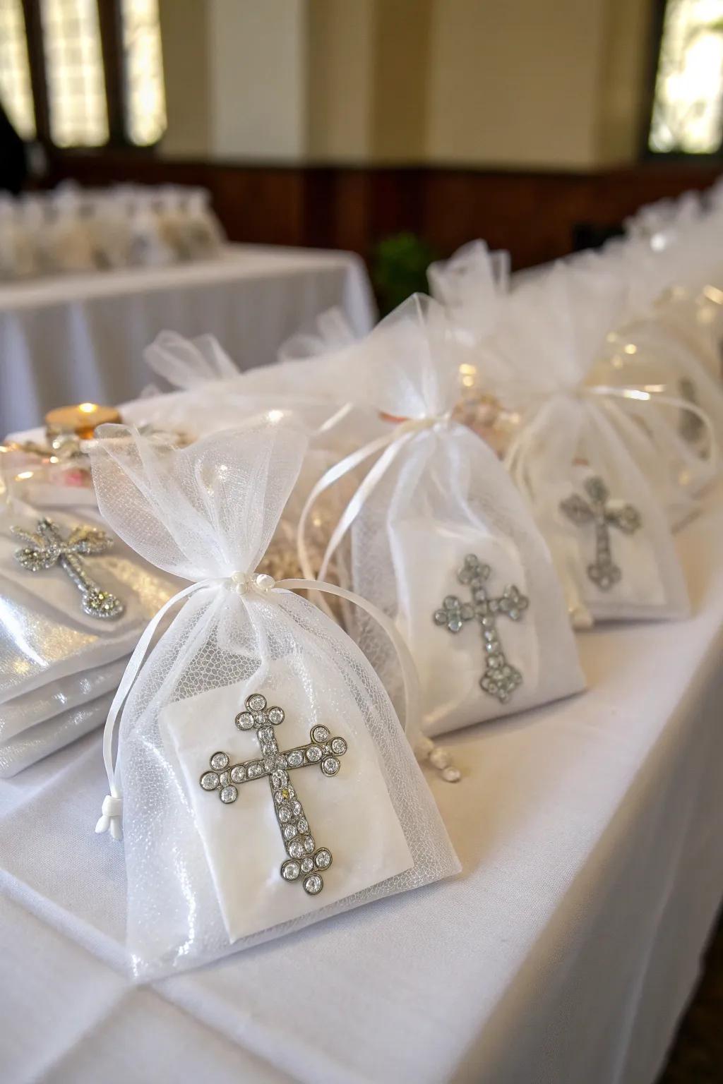 Miniature cross ornaments elegantly wrapped in organza bags, perfect for a baptism favor.