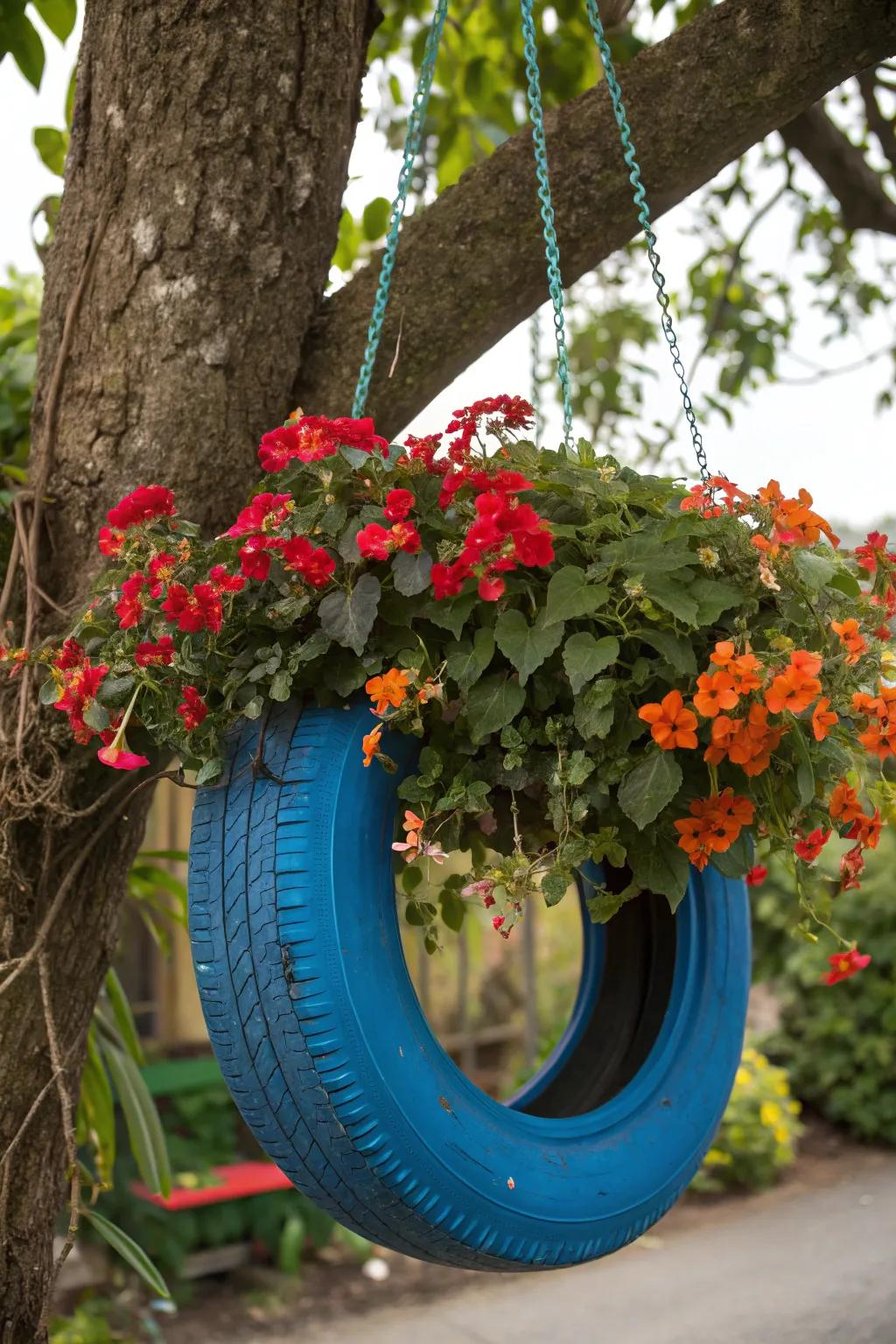 Elevate your garden with this stunning hanging tire planter and let nature's chandelier shine!