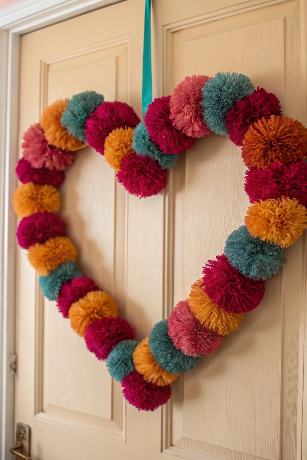 Add a splash of joy to your home with this vibrant Pom-Pom Heart Wreath, perfect for bringing warmth to wintery days!