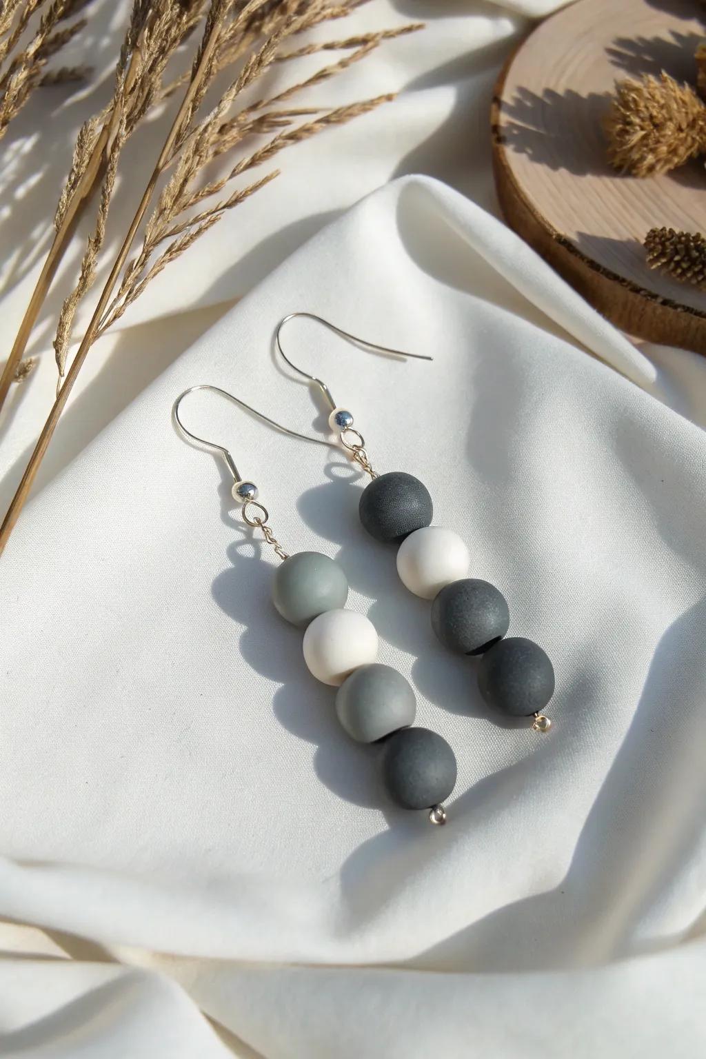 Elevate your style with these chic monochrome clay bead earrings—where simplicity meets elegance.