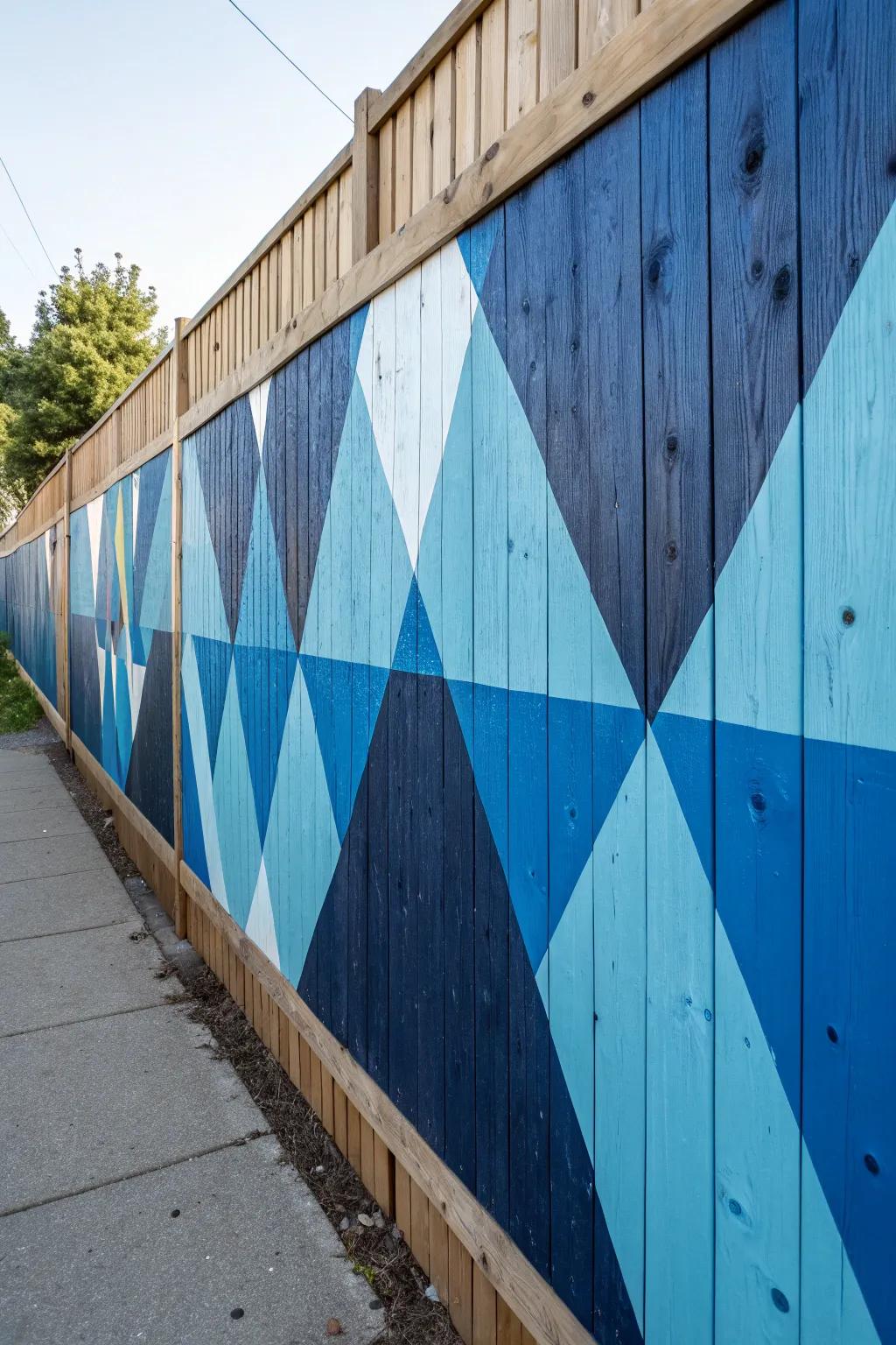 Transform your outdoor space with bold geometric flair. Discover the art of fence painting with modern blue triangles.