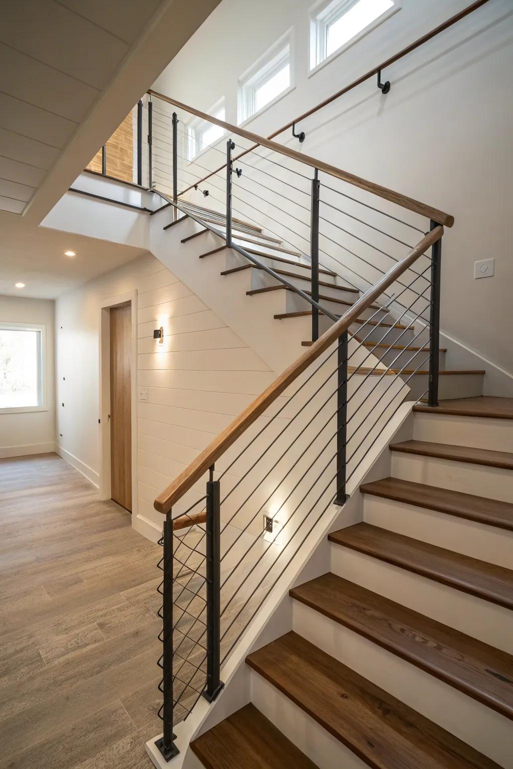 Cable railings provide a modern and open feel to basement stairs.