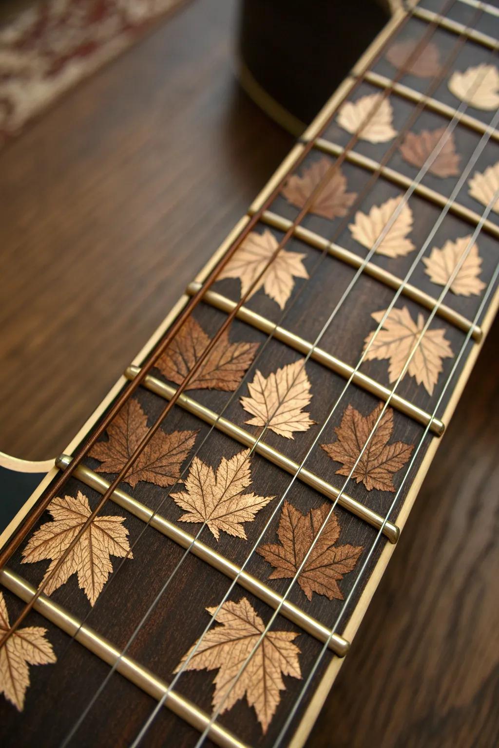 Craftsmanship meets nature: stunning maple leaf inlays on a guitar fretboard.