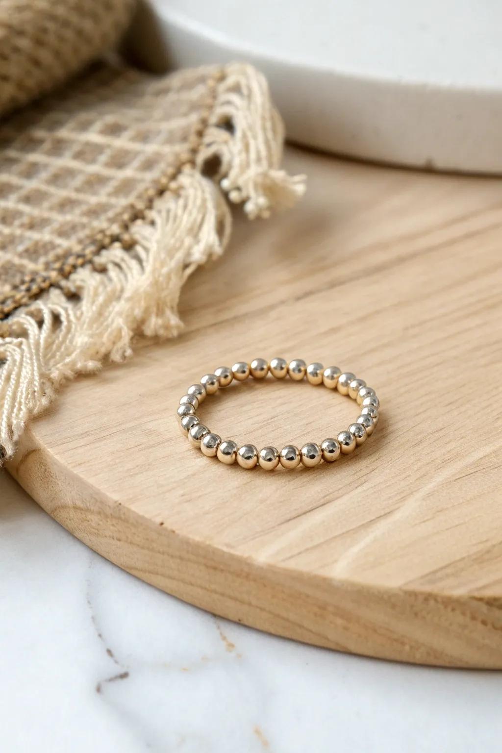 Shine bright with this handcrafted metallic seed bead ring, perfect for adding a touch of glam to any outfit.