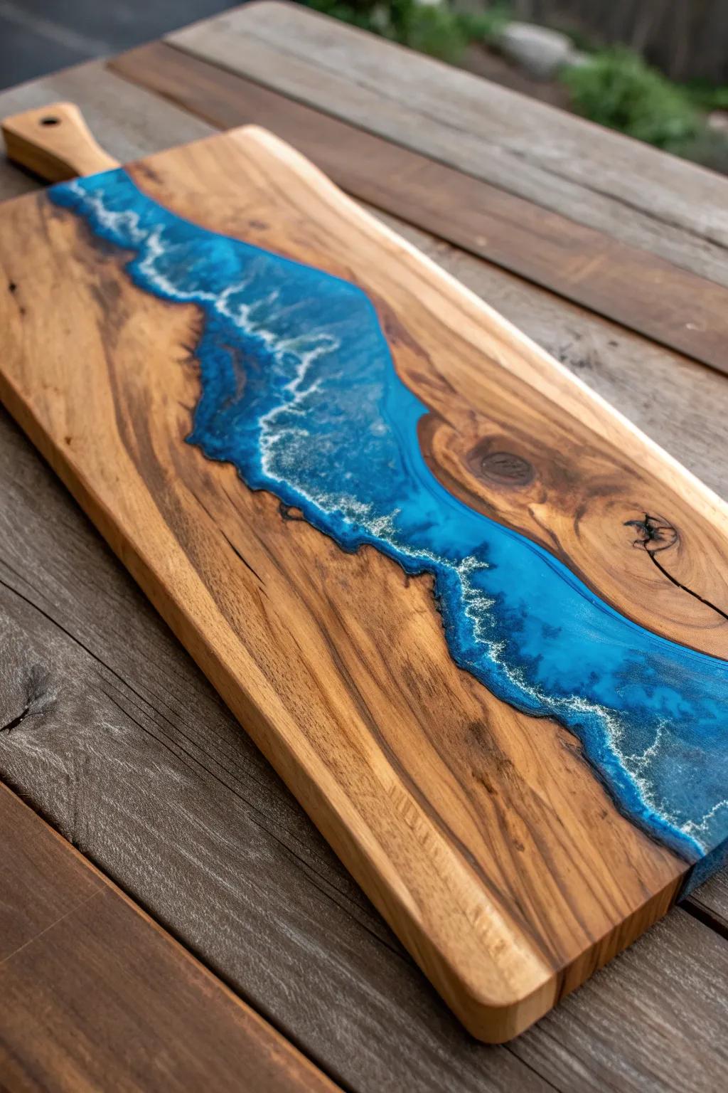 Elevate your charcuterie experience with a handcrafted board featuring flowing blue resin inlays.
