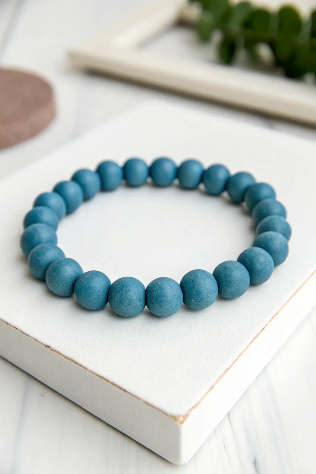 Embrace the elegance of simplicity with this minimalist blue clay bead bracelet.