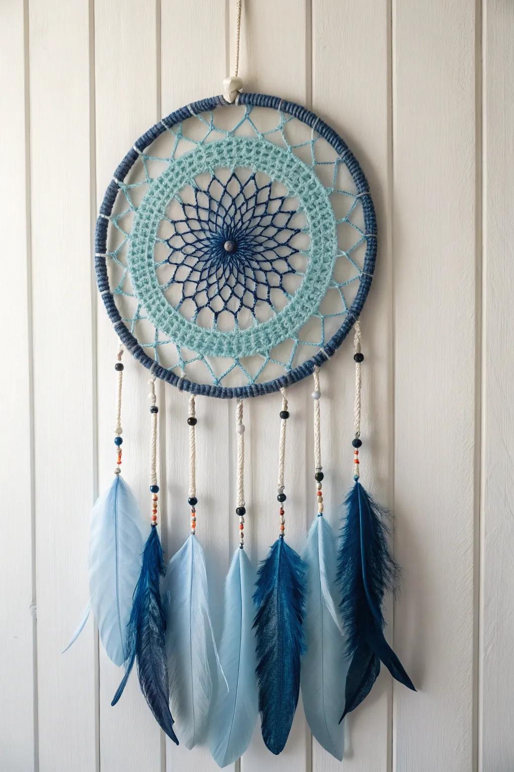 Embrace the tranquility of monochrome magic with this elegantly crafted dream catcher in serene shades of blue.