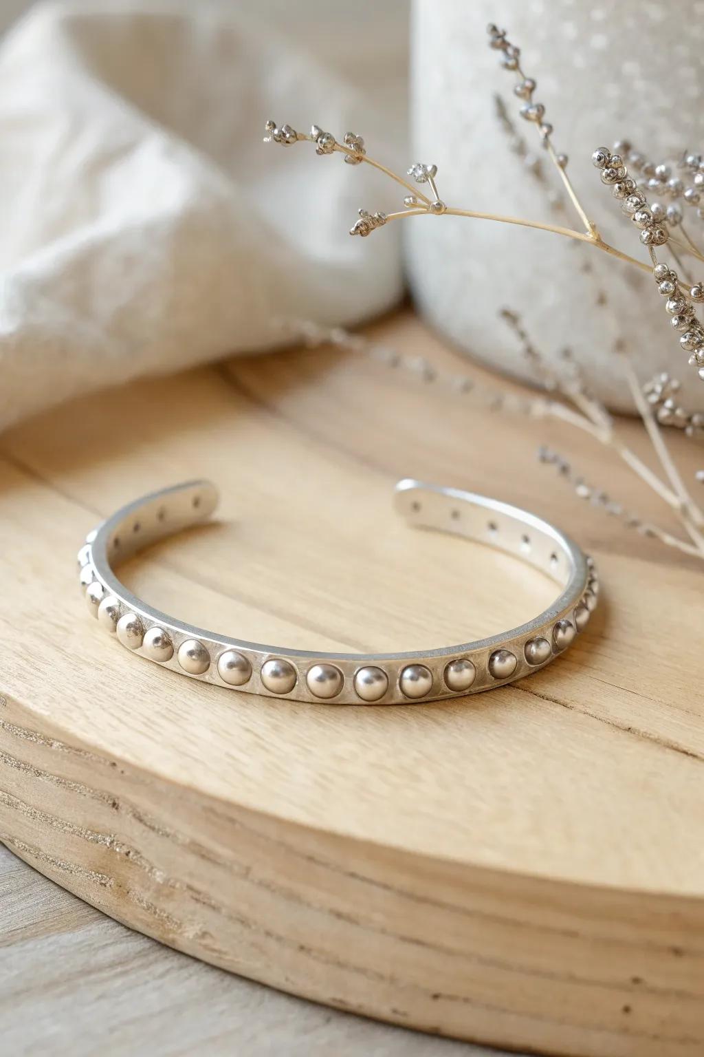 Elevate your style with an edgy yet minimalist touch. Discover the allure of studded elegance.