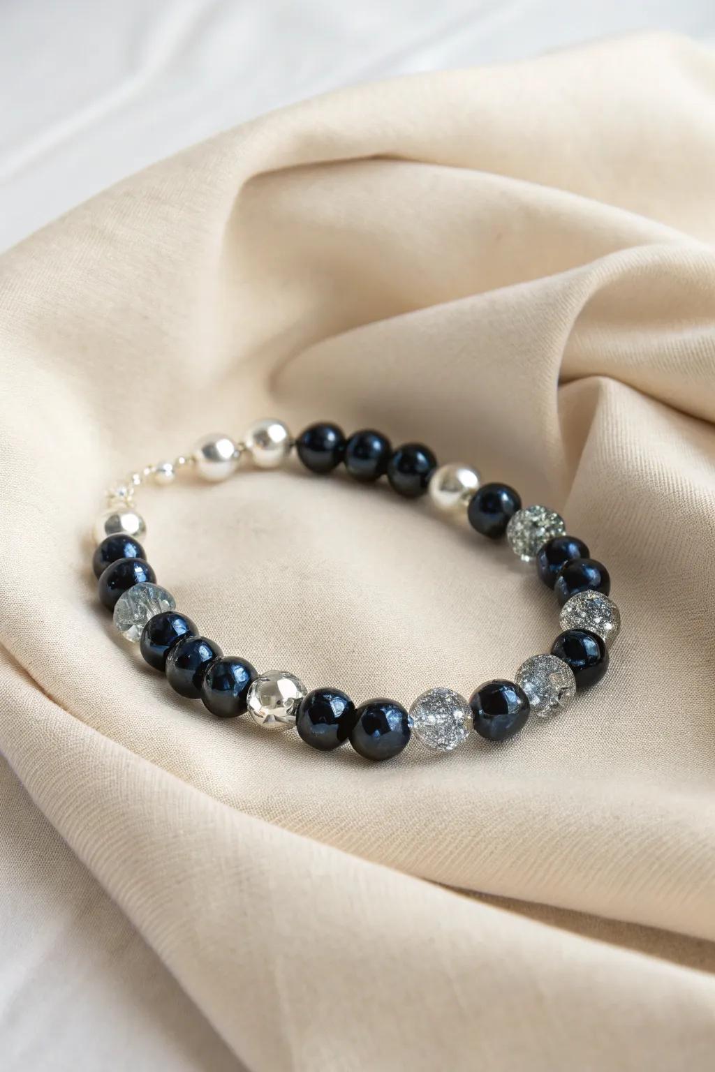 Capture the cosmos on your wrist with this galaxy-inspired glass bead bracelet. Perfect for starry night dreamers.