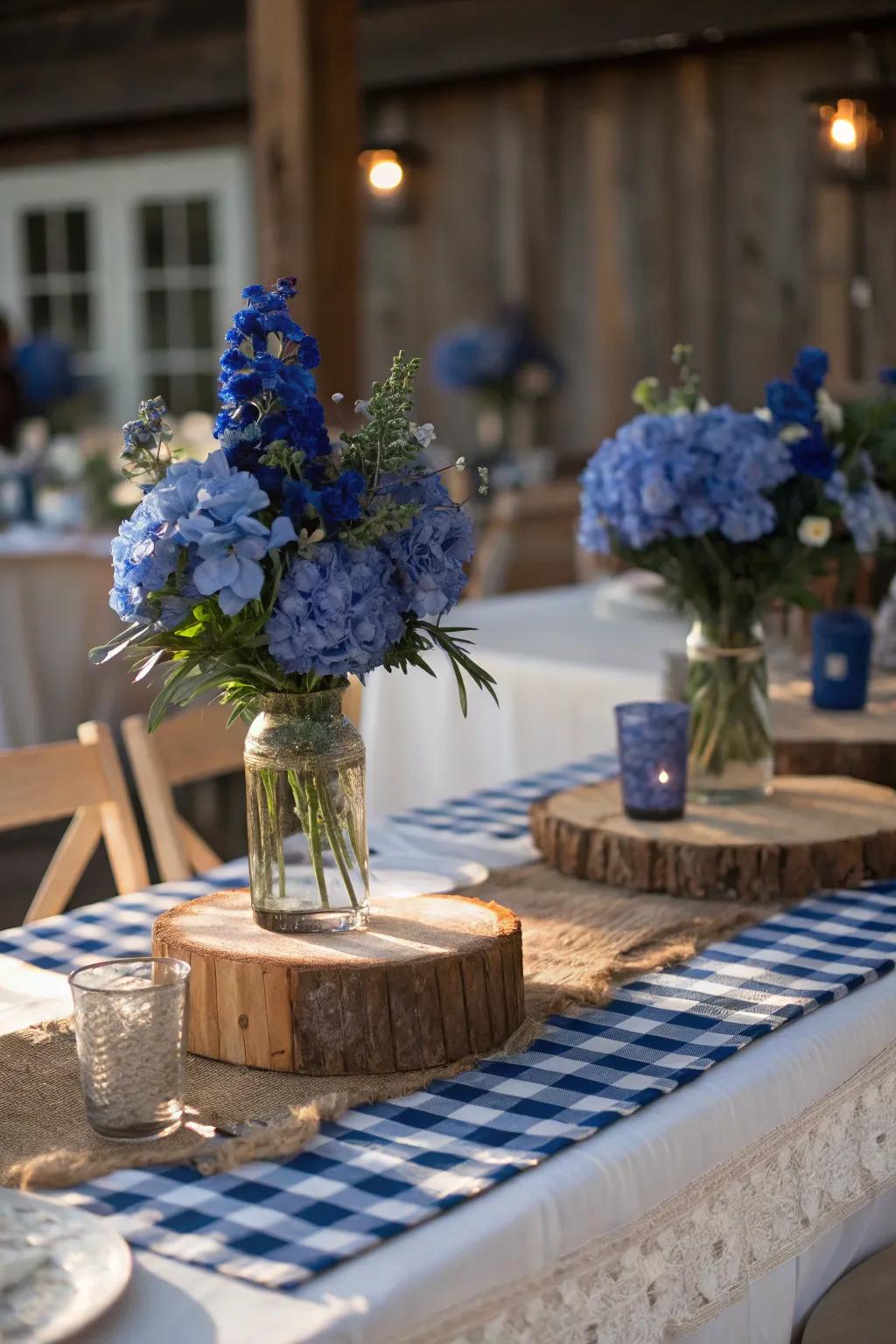 Wooden elements paired with royal blue flowers create a charming and rustic centerpiece.