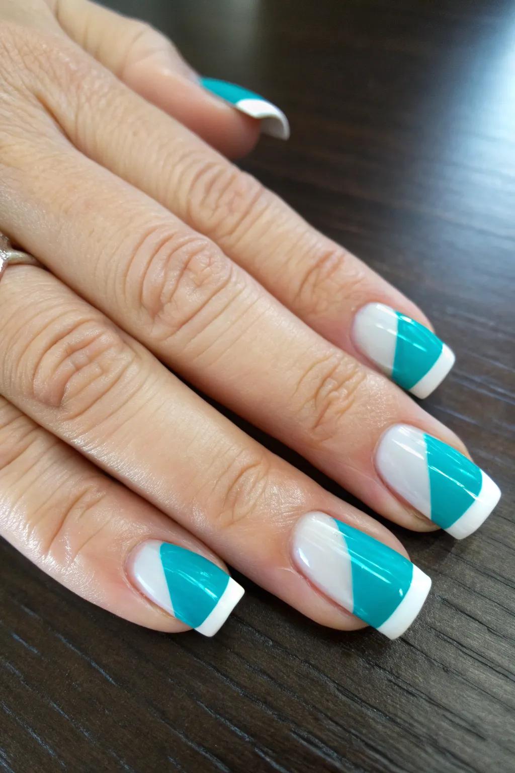 Reimagine classic elegance with a bold twist: striking teal French tips for the modern craftsman.